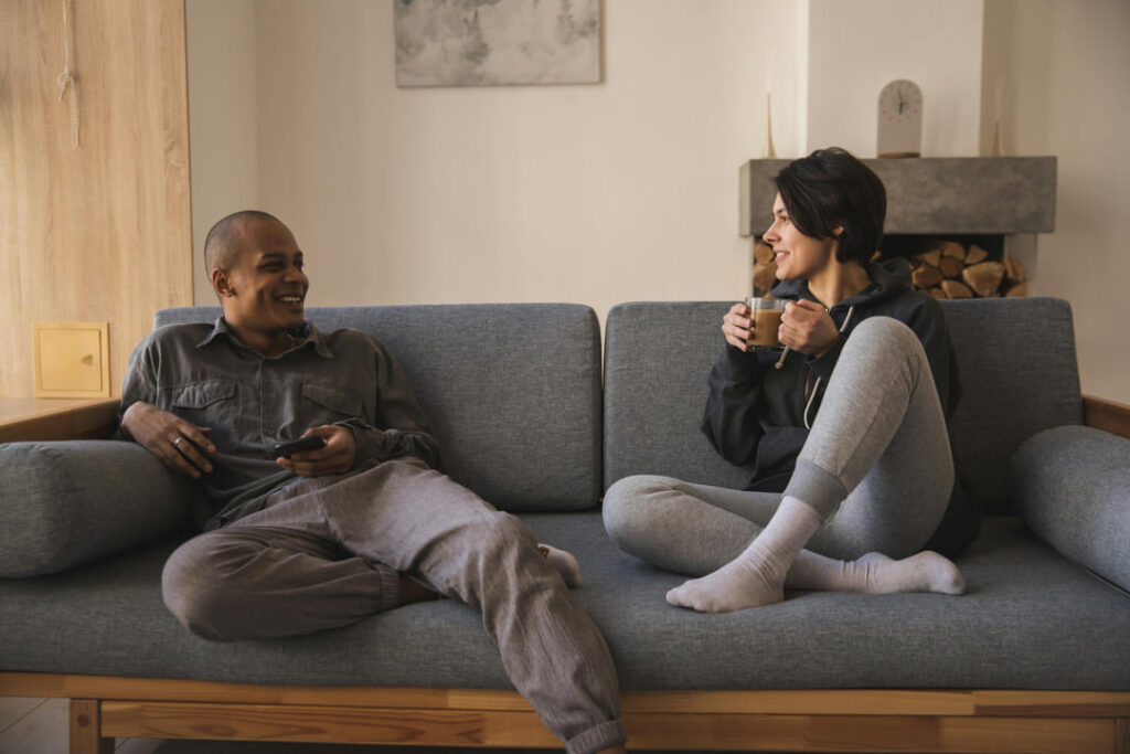 a couple talking on the couch