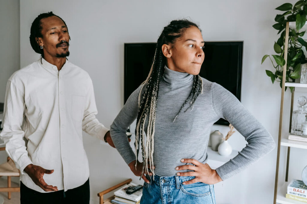 a couple arguing in their living room