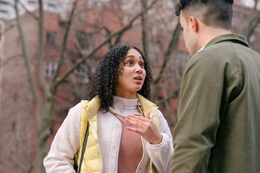 a couple arguing outside