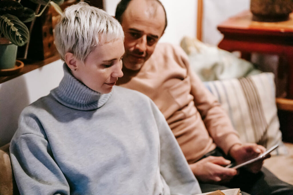 a couple talking on their couch