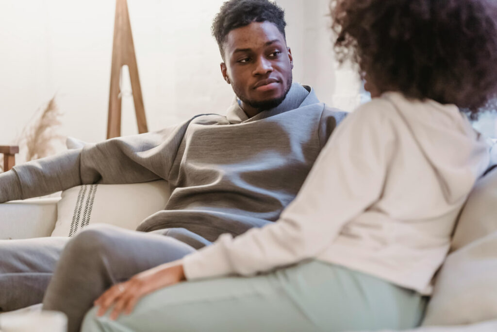 a man looking at his girlfriend