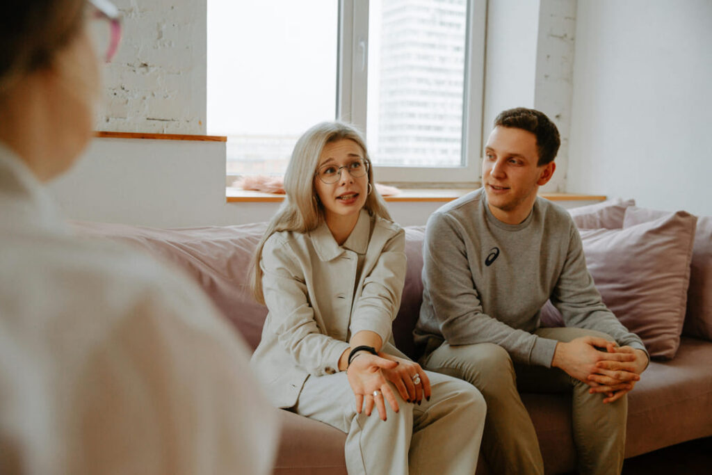 a couple talking to a counselor