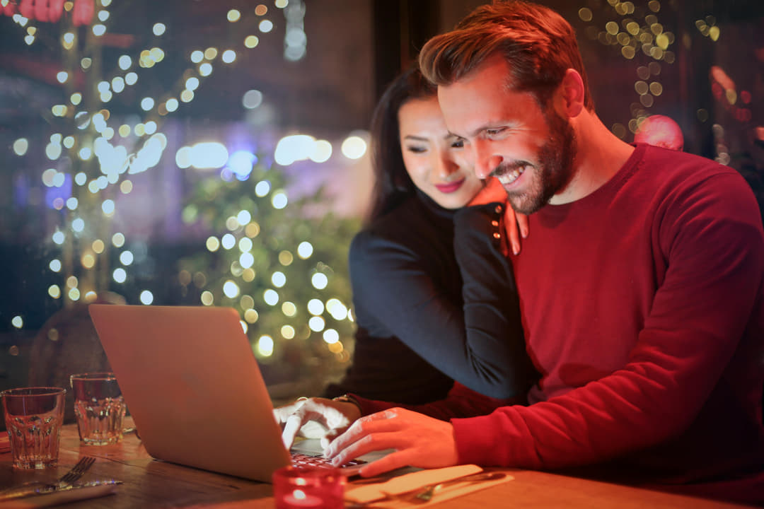 a couple on their laptop