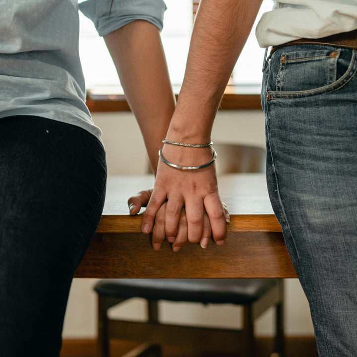 a couple holding hands