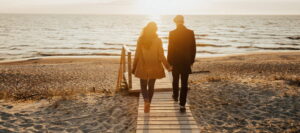 a couple walking on the beach