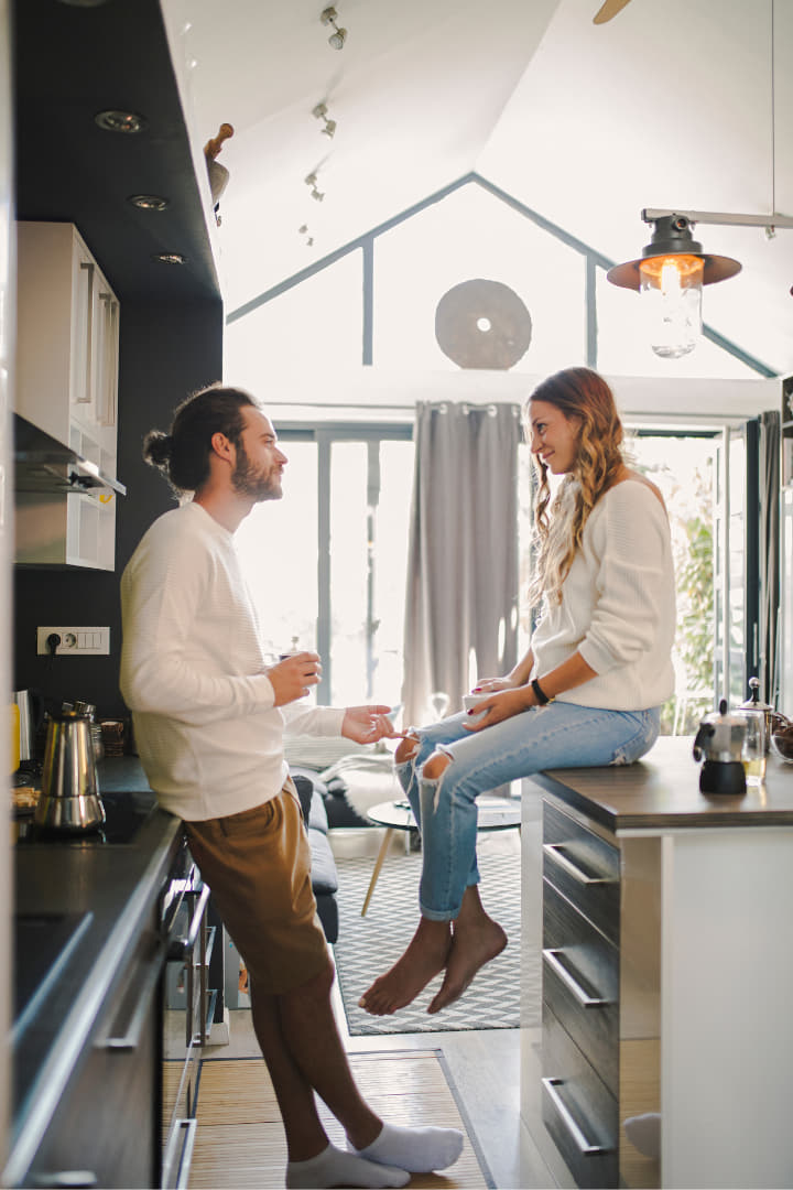 a couples communicating in their kitchen